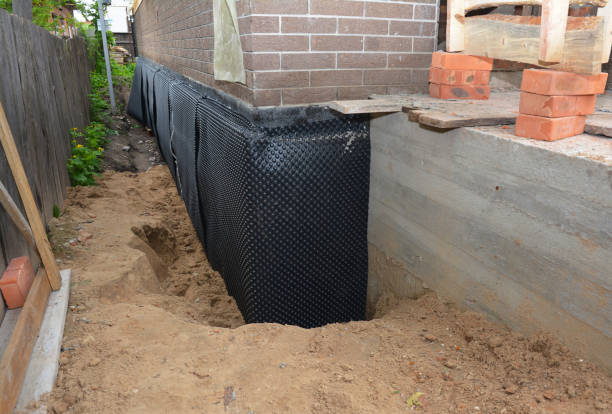 Happy homeowners after waterproofing job in Charlotte